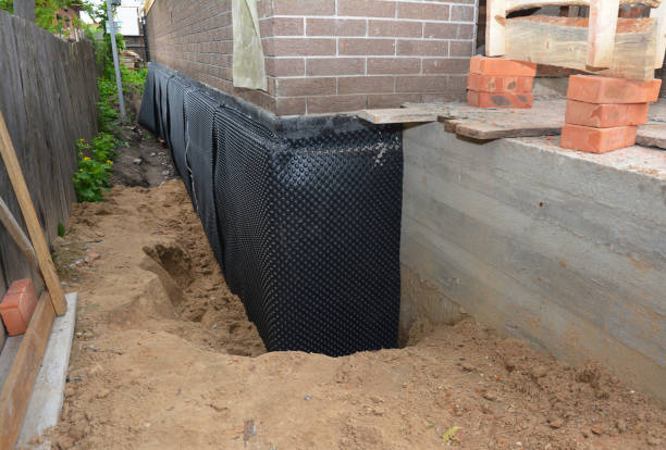 SJ Waterproofing Pros technician performing targeted Waterproofing assessment in Defiance, OH